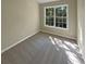 Bright bedroom with carpet flooring and a large window at 20 Pine Canyon Sw Dr # 24, Atlanta, GA 30331