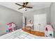 ' bedroom with white furniture, hardwood floors, and double doors at 1085 Queensgate Se Dr, Smyrna, GA 30082