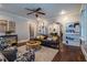 Spacious living room with hardwood floors, comfy seating, and built-in shelving at 2130 Perkerson Mill Rd, Austell, GA 30106