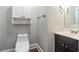 Small bathroom with toilet and a dark vanity at 2130 Perkerson Mill Rd, Austell, GA 30106