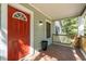 Front porch with red door and stone floor at 2130 Perkerson Mill Rd, Austell, GA 30106