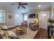 Open living room with hardwood floors, comfortable seating, and lots of natural light at 2130 Perkerson Mill Rd, Austell, GA 30106