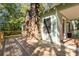 Wooden deck with stone chimney and wooded view at 2130 Perkerson Mill Rd, Austell, GA 30106