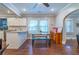 Bright dining area with hardwood floors and kitchen access at 2130 Perkerson Mill Rd, Austell, GA 30106
