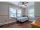 Bright bedroom with hardwood floors and two windows at 2130 Perkerson Mill Rd, Austell, GA 30106