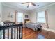 Cozy bedroom featuring hardwood floors and a crib at 2130 Perkerson Mill Rd, Austell, GA 30106