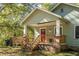 House exterior with wooden porch and steps at 2130 Perkerson Mill Rd, Austell, GA 30106