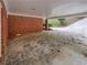 Covered carport area with brick exterior at 6095 Blackberry Ln, Buford, GA 30518