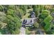 Aerial view of two-story house, detached garage, and large lot at 1720 Mountainside Dr, Cumming, GA 30040