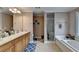 Elegant bathroom with double vanity, soaking tub, and shower at 1720 Mountainside Dr, Cumming, GA 30040