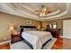 Spacious Primary bedroom with hardwood floors and a ceiling fan at 1720 Mountainside Dr, Cumming, GA 30040