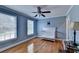 Serene bedroom with light blue walls, hardwood floors, and a white daybed at 1720 Mountainside Dr, Cumming, GA 30040