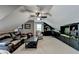 Spacious bonus room offering a comfortable sitting area and built-in entertainment center at 1720 Mountainside Dr, Cumming, GA 30040