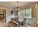 Breakfast nook with white table, bench seating, and a view of the backyard at 1720 Mountainside Dr, Cumming, GA 30040