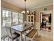 Bright breakfast nook with white table, bench seating, and a view of the backyard at 1720 Mountainside Dr, Cumming, GA 30040