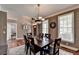 Formal dining room with hardwood floors, a chandelier and large windows at 1720 Mountainside Dr, Cumming, GA 30040