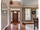 Bright entryway with hardwood floors, a large mirror, and a decorative door at 1720 Mountainside Dr, Cumming, GA 30040