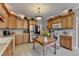 Kitchen with light wood cabinets, stainless steel appliances, and a farmhouse island at 1720 Mountainside Dr, Cumming, GA 30040