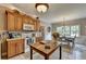 Kitchen with light wood cabinets, stainless steel appliances, and a farmhouse island at 1720 Mountainside Dr, Cumming, GA 30040
