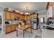 Kitchen with light wood cabinets, stainless steel appliances, and a farmhouse island at 1720 Mountainside Dr, Cumming, GA 30040