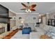 Spacious living room featuring a cozy fireplace and sectional sofa at 1720 Mountainside Dr, Cumming, GA 30040