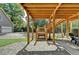 Brick patio under the deck with a wooden staircase leading to the yard at 1720 Mountainside Dr, Cumming, GA 30040