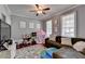 Playful ' room with toys, a sectional sofa, and a TV at 1720 Mountainside Dr, Cumming, GA 30040