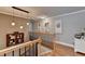 Bright upstairs hall with hardwood floors and picture frames at 1720 Mountainside Dr, Cumming, GA 30040