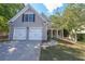 Inviting two-story home with a two-car garage and covered entryway at 3131 Mill Park Ter, Dacula, GA 30019