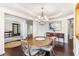 Elegant dining room with hardwood floors, chandelier, and round table at 2470 Bridle Bridge Trl, Cumming, GA 30040