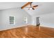 Large living area with hardwood floors and high ceilings at 646 Old Cumming Rd, Sugar Hill, GA 30518