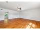 Spacious bedroom with hardwood floors and built-in shelving at 646 Old Cumming Rd, Sugar Hill, GA 30518