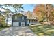 Gray house with white trim, a covered porch, and a two-car garage at 121 Mill Ln, Dallas, GA 30157