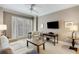 Spacious living room with plush sofas and a large TV at 2255 Peachtree Rd # 328, Atlanta, GA 30309