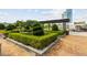 Relaxing courtyard with lush greenery, a pergola, and seating areas at 2255 Peachtree Rd # 328, Atlanta, GA 30309