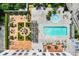 Aerial view of community pool, hot tub, patio, and landscaped areas at 2255 Peachtree Rd # 328, Atlanta, GA 30309