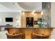 Kitchen with an island and breakfast bar, wood cabinets and granite countertop at 2255 Peachtree Rd # 328, Atlanta, GA 30309