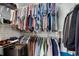 Well-organized walk-in closet with ample hanging space and shelving at 2255 Peachtree Rd # 328, Atlanta, GA 30309