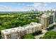 Aerial perspective showcasing building and surrounding green space at 2255 Peachtree Rd # 328, Atlanta, GA 30309