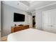 Main bedroom with large TV, dresser, and walk-in closet at 2255 Peachtree Rd # 328, Atlanta, GA 30309