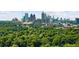 Stunning aerial view showcasing the city skyline and lush treetops at 2255 Peachtree Rd # 328, Atlanta, GA 30309