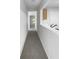 Long hallway with gray carpeting and access to other rooms at 3217 Fairington Dr, Lithonia, GA 30038