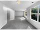 Spacious bedroom with grey carpeting and large windows at 3217 Fairington Dr, Lithonia, GA 30038