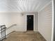 Exterior entryway with black door and wooden deck at 3217 Fairington Dr, Lithonia, GA 30038