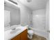 Clean bathroom with white tub and wood vanity at 3217 Fairington Dr, Lithonia, GA 30038