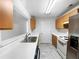 Kitchen with wood cabinets, white appliances and tile floor at 3217 Fairington Dr, Lithonia, GA 30038