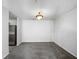 Simple dining room with gray carpeting and a ceiling light fixture at 3217 Fairington Dr, Lithonia, GA 30038
