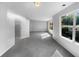 Spacious bedroom with grey carpeting and large windows at 3217 Fairington Dr, Lithonia, GA 30038