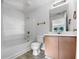 Clean bathroom featuring a bathtub, toilet, and wood vanity at 3217 Fairington Dr, Lithonia, GA 30038
