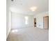 Spacious bedroom with carpet, and view into kitchen at 7375 Winderlea Ln, Cumming, GA 30040